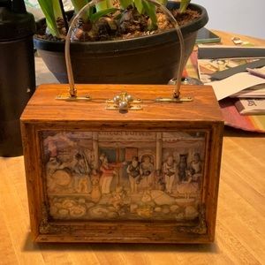 Lavish handed carved box purse